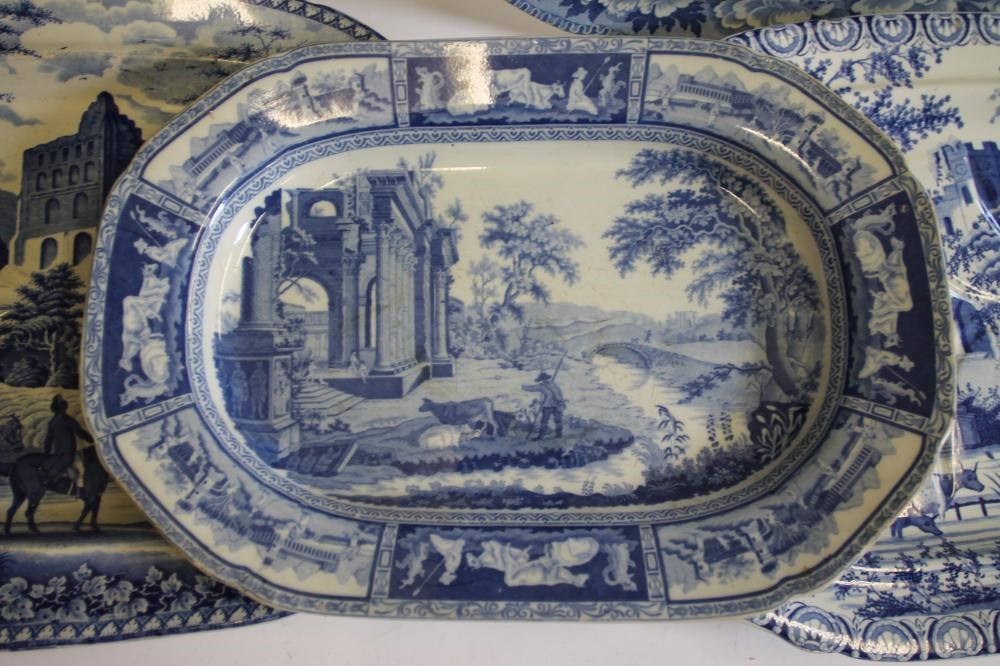 A COLLECTION OF FIVE BLUE AND WHITE PRINTED EARTHENWARE MEAT PLATES including Adams "Cowherds near Image