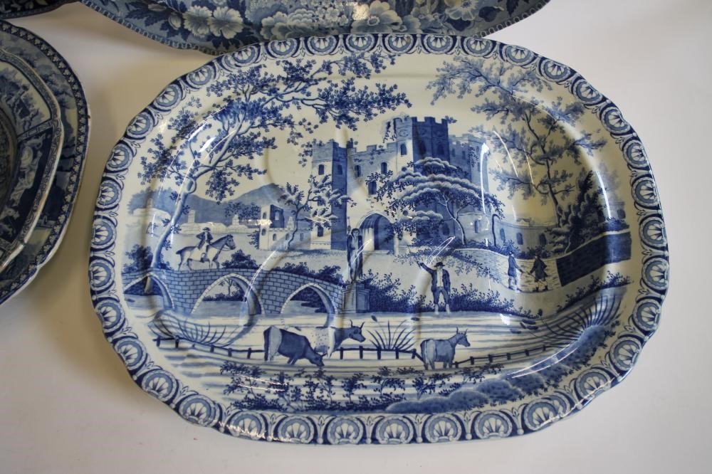 A COLLECTION OF FIVE BLUE AND WHITE PRINTED EARTHENWARE MEAT PLATES including Adams "Cowherds near Image