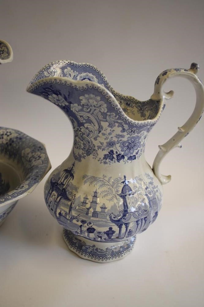 A COLLECTION OF SIX BLUE AND WHITE PRINTED EARTHENWARE JUGS Image