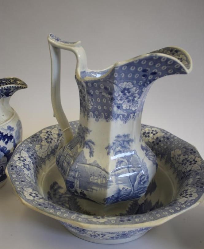 A COLLECTION OF SIX BLUE AND WHITE PRINTED EARTHENWARE JUGS Image