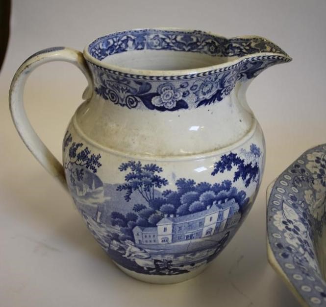 A COLLECTION OF SIX BLUE AND WHITE PRINTED EARTHENWARE JUGS Image