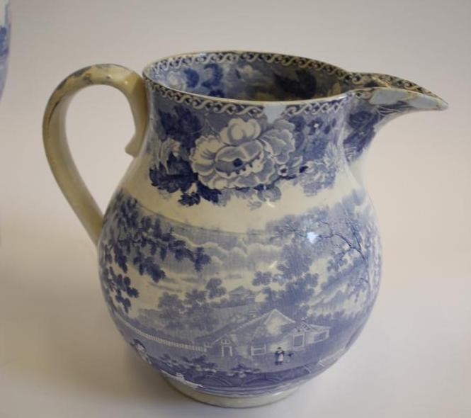 A COLLECTION OF SIX BLUE AND WHITE PRINTED EARTHENWARE JUGS Image