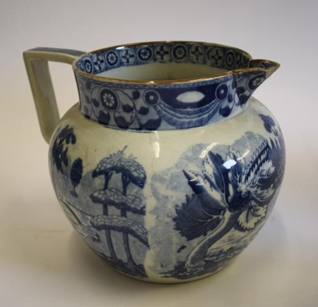 A COLLECTION OF SIX BLUE AND WHITE PRINTED EARTHENWARE JUGS Image
