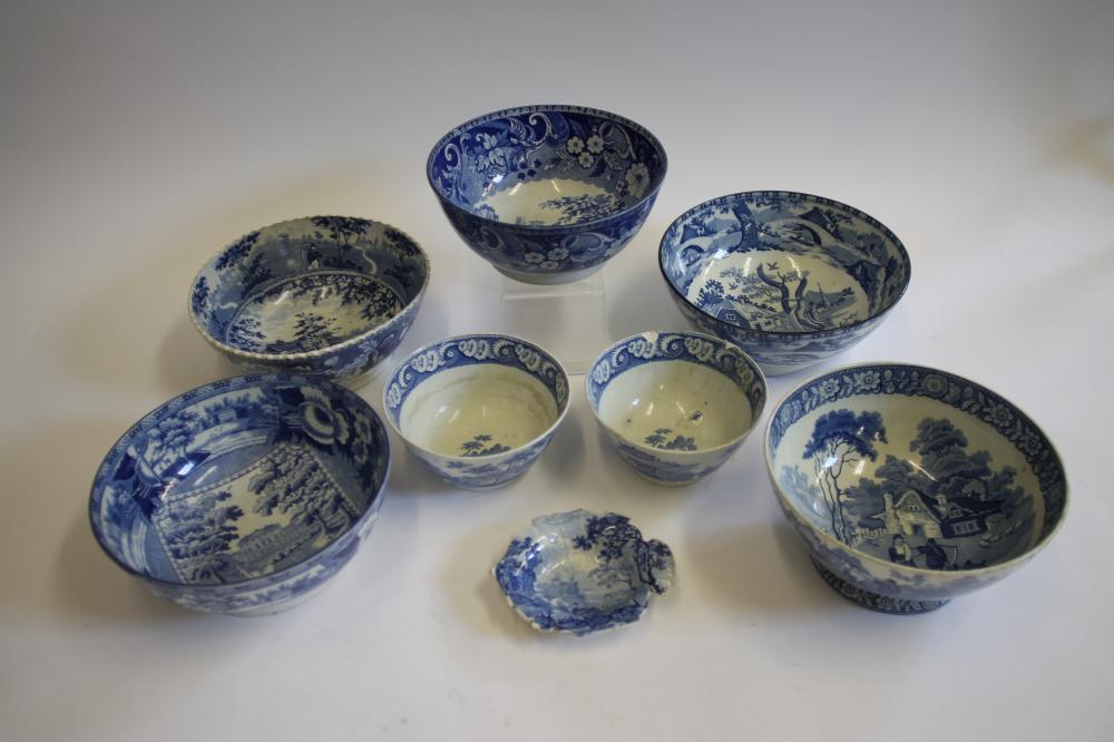 A COLLECTION OF EIGHT BLUE AND WHITE PRINTED EARTHENWARE BOWLS Image