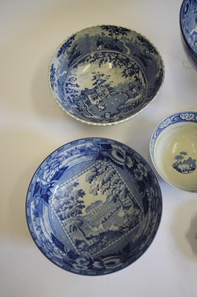 A COLLECTION OF EIGHT BLUE AND WHITE PRINTED EARTHENWARE BOWLS Image