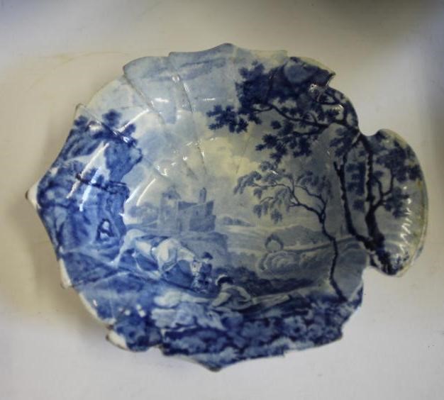 A COLLECTION OF EIGHT BLUE AND WHITE PRINTED EARTHENWARE BOWLS Image