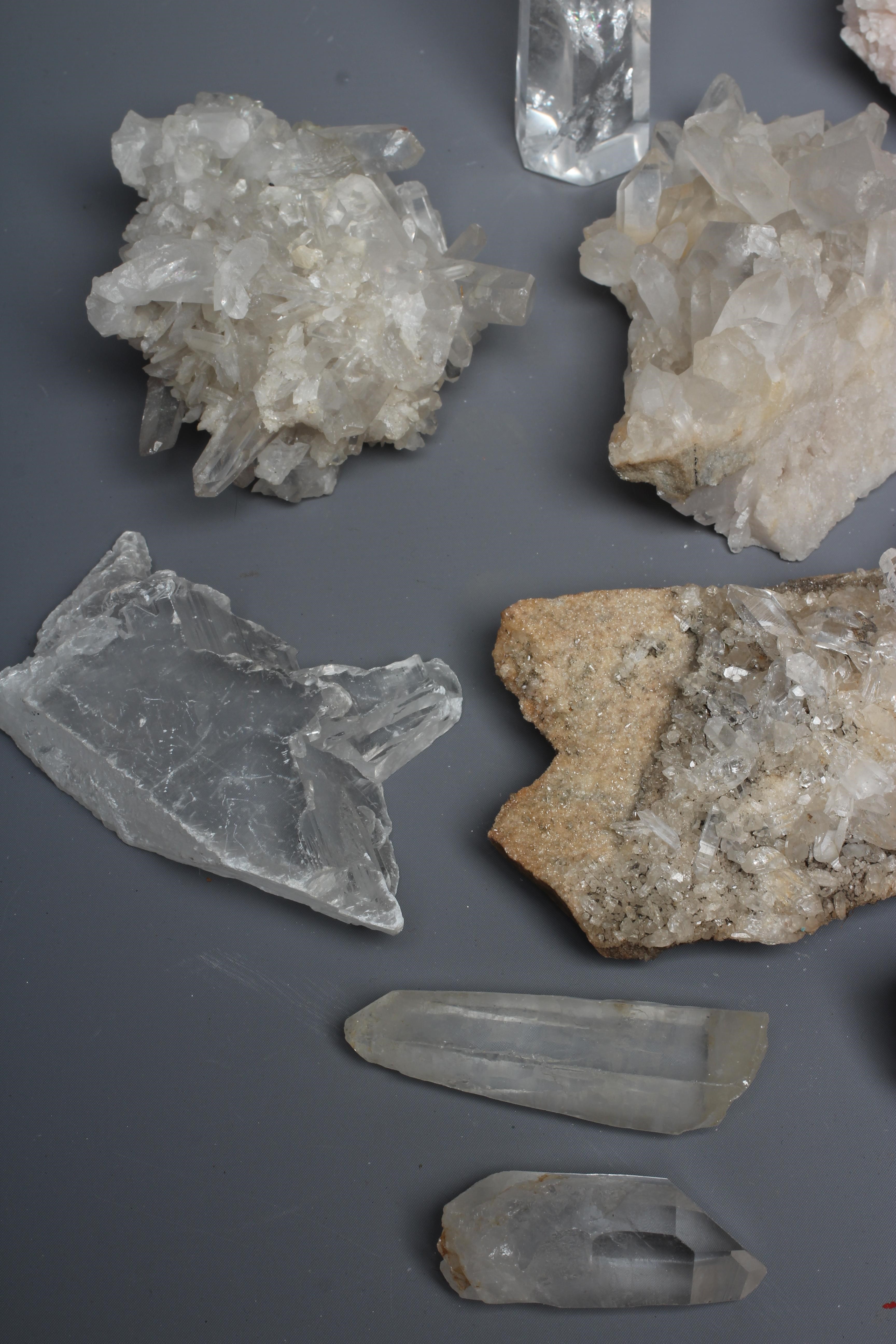A collection of crystal clusters & geodes, including spirit quartz ...