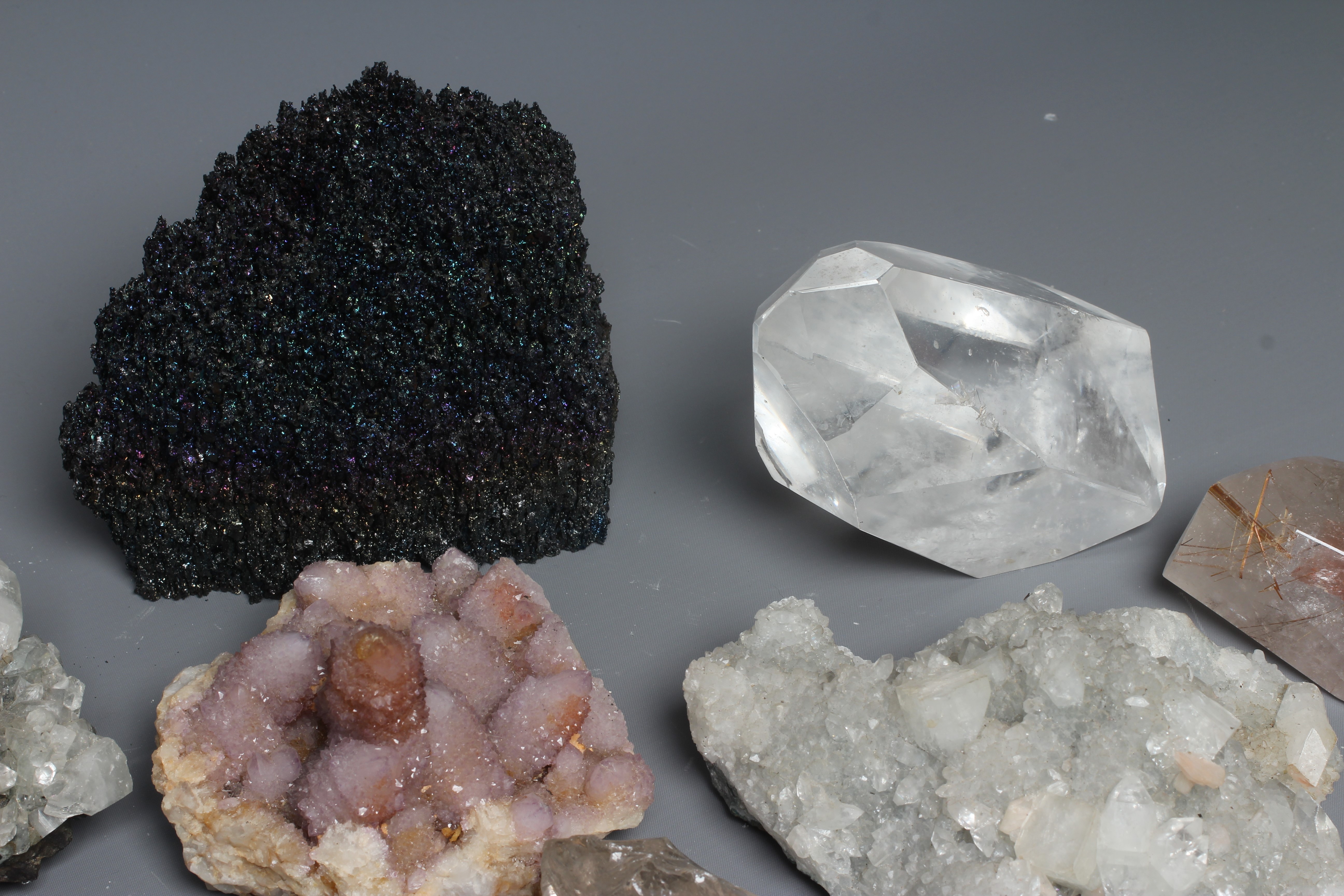 A collection of crystal clusters & geodes, including spirit quartz ...