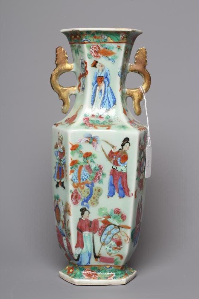 A CANTONESE PORCELAIN FAMILLE ROSE TWO HANDLED VASE of rounded hexagonal form, painted with figures Image