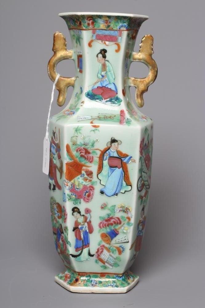 A CANTONESE PORCELAIN FAMILLE ROSE TWO HANDLED VASE of rounded hexagonal form, painted with figures Image