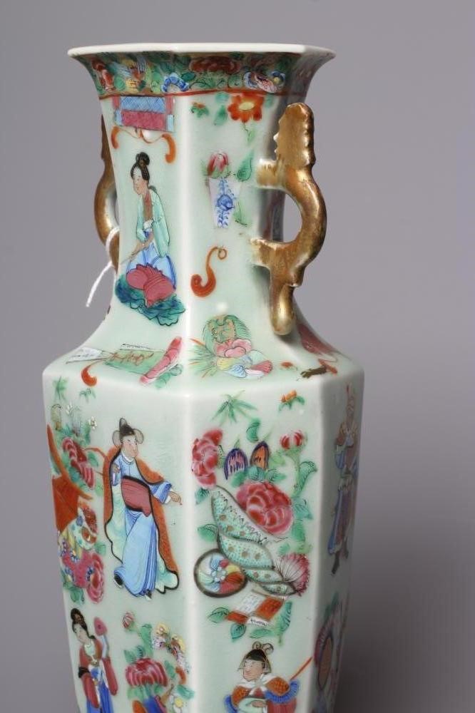 A CANTONESE PORCELAIN FAMILLE ROSE TWO HANDLED VASE of rounded hexagonal form, painted with figures Image