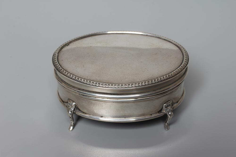 A GEORGE V OVAL SILVER DRESSING TABLE BOX by Mappin & Webb Image
