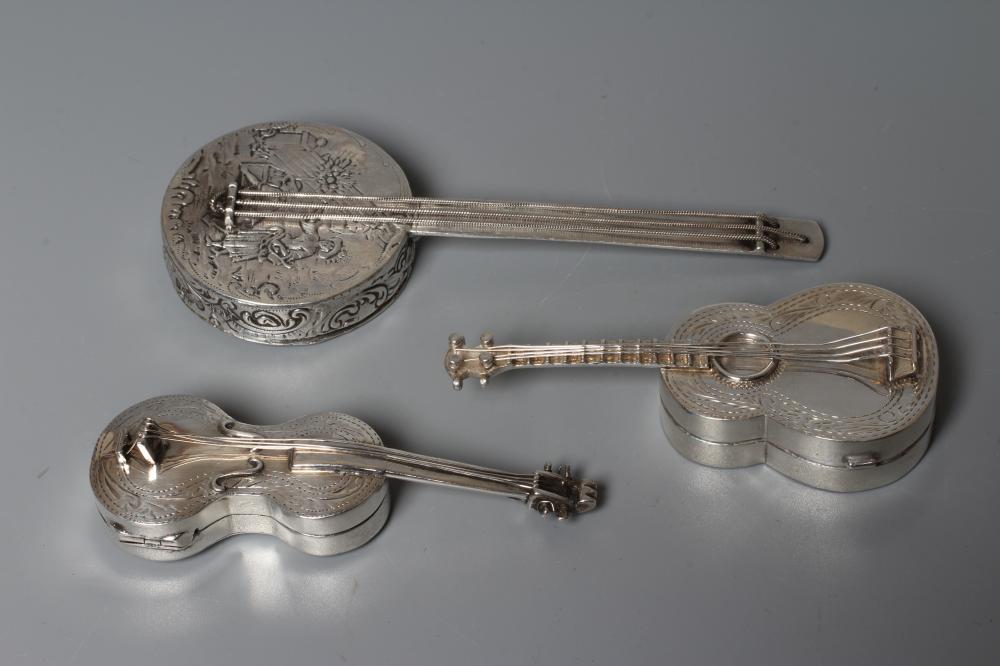 THREE MUSICAL INSTRUMENT NOVELTY BOXES comprising a silver guitar, Sheffield 1902, 3" long, an Image