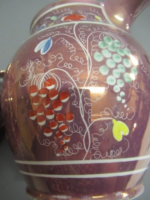 A COLLECTION OF PINK SPLASH LUSTRE POTTERY Image