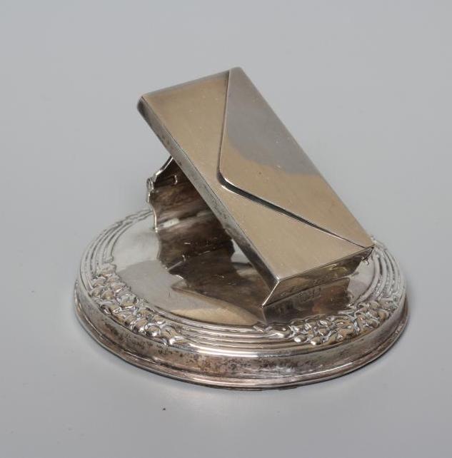 OF PHILATELIC INTEREST - AN EDWARDIAN NOVELTY DESK CLIP/PAPERWEIGHT Image