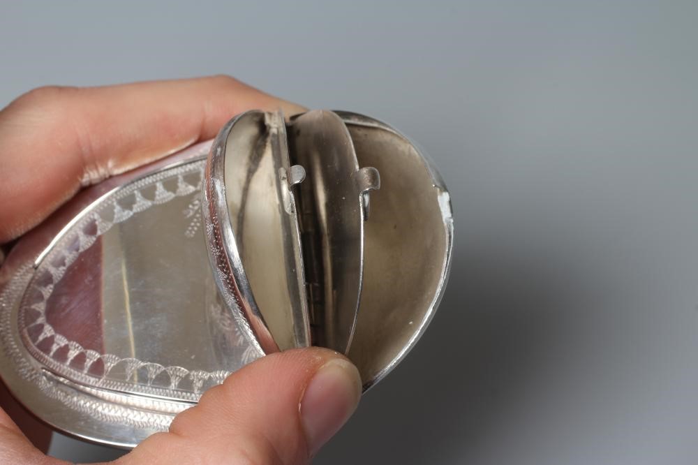 OF PHILATELIC INTEREST - A SNUFF/STAMP BOX, unmarked, of concave oval form with engraved decoration Image