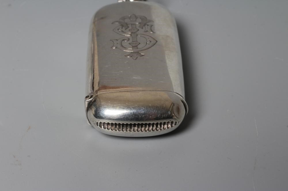 A LATE VICTORIAN SILVER VESTA AND COMBINED SOVEREIGN HOLDER, maker's mark JMM, Birmingham 1894, of Image