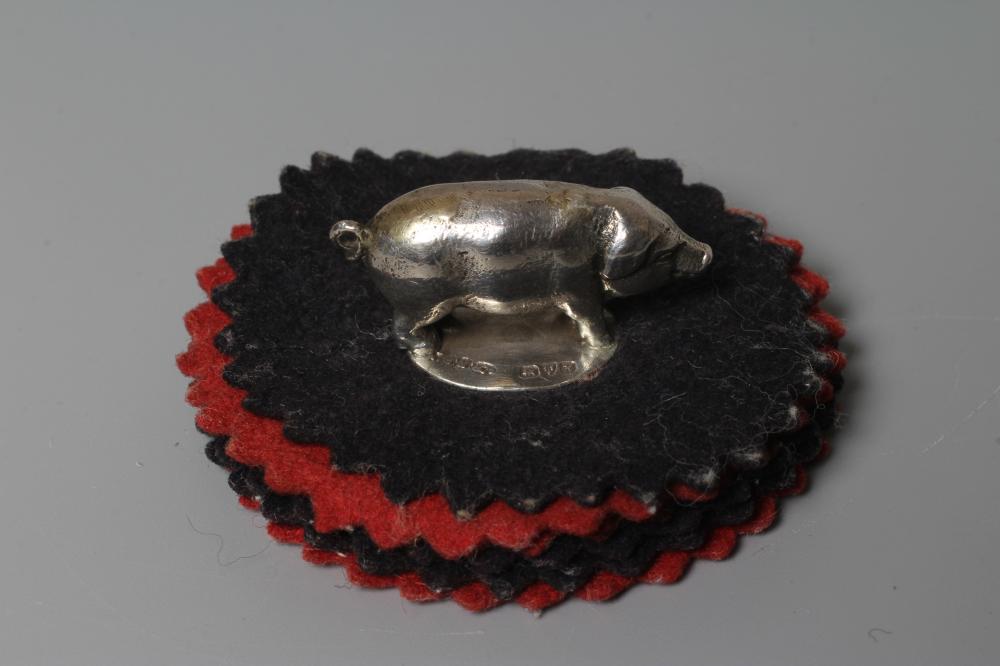 AN EDWARDIAN SILVER NOVELTY PIG PEN WIPE by Sampson Mordan, Chester 1908, 1 1/4" long, fixed onto Image