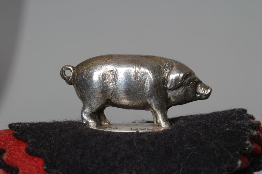 AN EDWARDIAN SILVER NOVELTY PIG PEN WIPE by Sampson Mordan, Chester 1908, 1 1/4" long, fixed onto Image