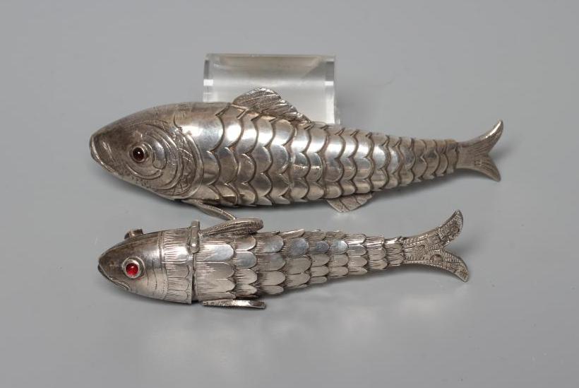TWO SMALL SILVER ARTICULATED FISH BOXES, one Chester import 1903, with inset red glass eyes, 4" Image