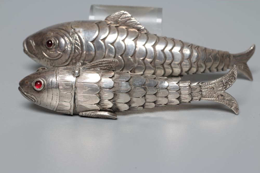 TWO SMALL SILVER ARTICULATED FISH BOXES, one Chester import 1903, with inset red glass eyes, 4" Image