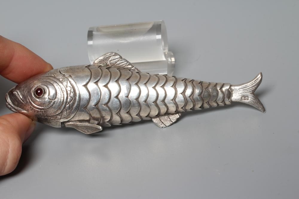 TWO SMALL SILVER ARTICULATED FISH BOXES, one Chester import 1903, with inset red glass eyes, 4" Image