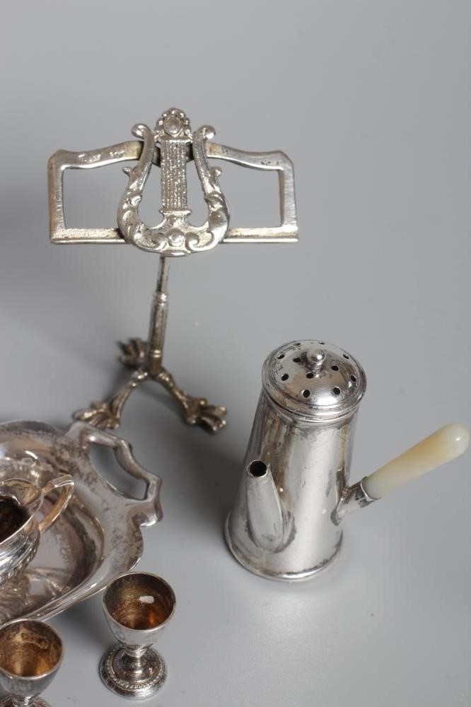 A COLLECTION OF SILVER TOYS comprising a novelty café-au-lait pepperette by William Vale Image