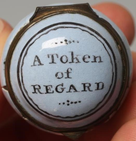 A SOUTH STAFFORDSHIRE ENAMEL ON COPPER EGG, late 18th century, the hinged cover inscribed 'A Token Image