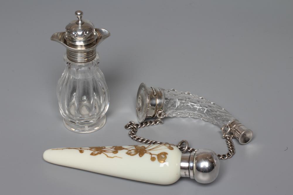 A THOMAS WEBB CREAM OPALINE GLASS SCENT FLASK of conical form with gilded flowers in the style of Image