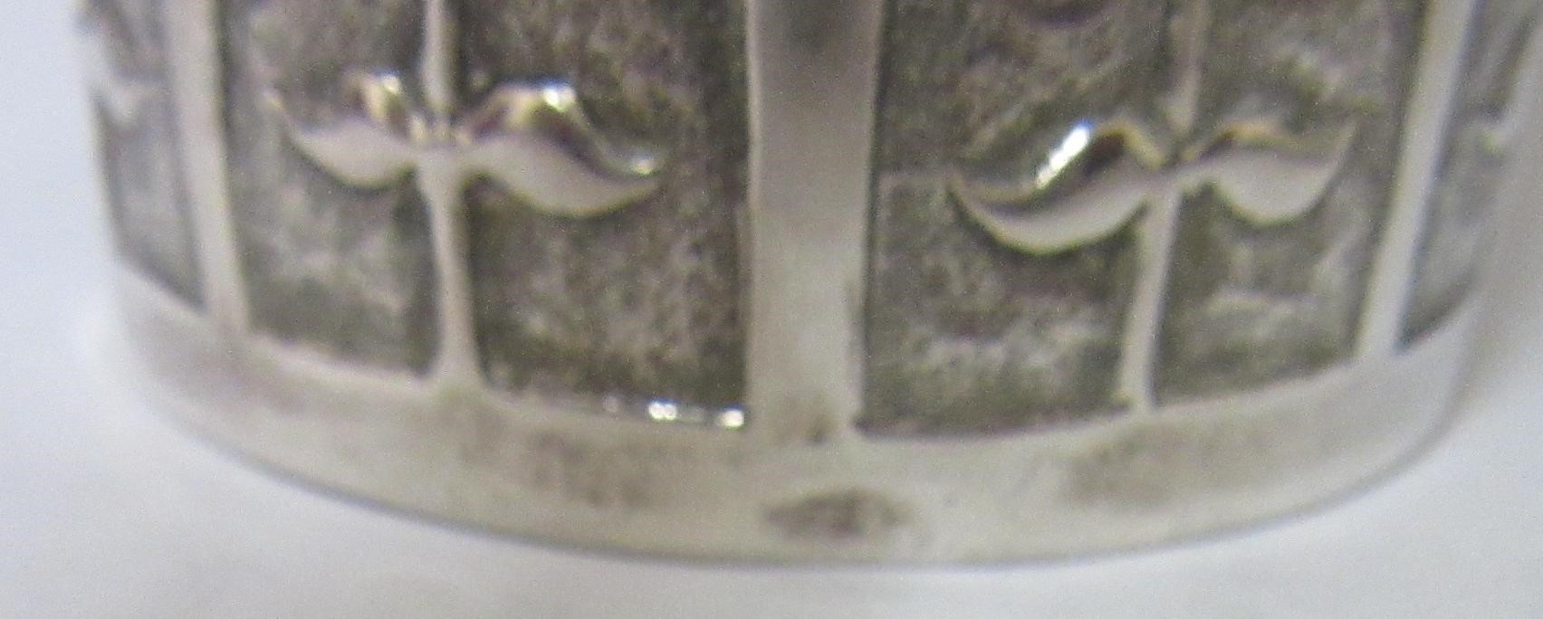 AN AUSTRIAN SILVER BEAKER, early 19th century, of flared cylindrical form, the lower section chased Image