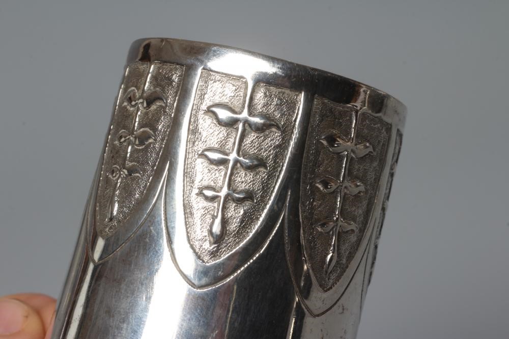 AN AUSTRIAN SILVER BEAKER, early 19th century, of flared cylindrical form, the lower section chased Image