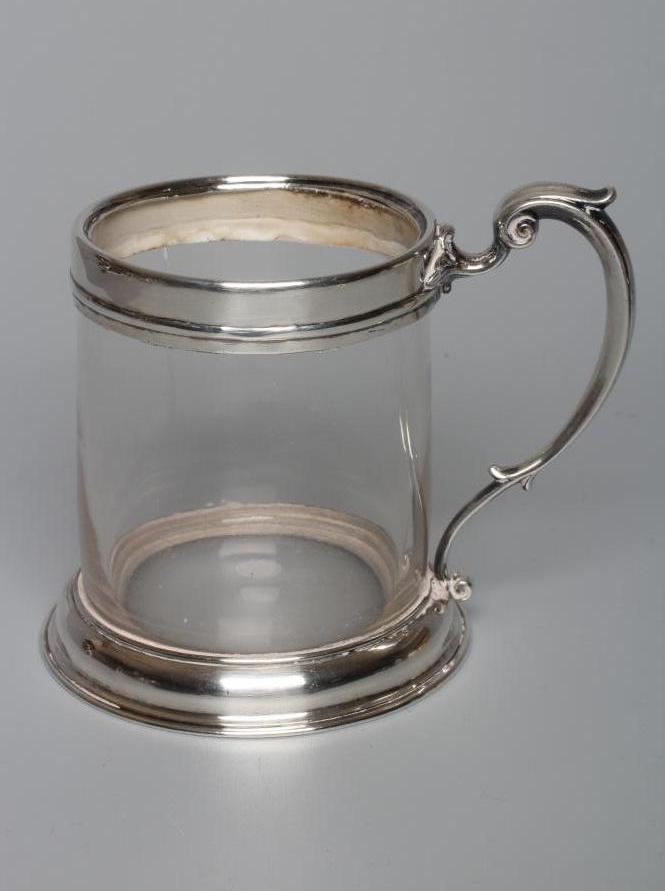 AN EARLY VICTORIAN SILVER MUG by John Wilmin Figg, London 1856, the clear glass cylindrical body Image