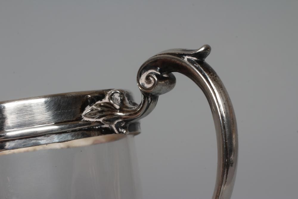 AN EARLY VICTORIAN SILVER MUG by John Wilmin Figg, London 1856, the clear glass cylindrical body Image
