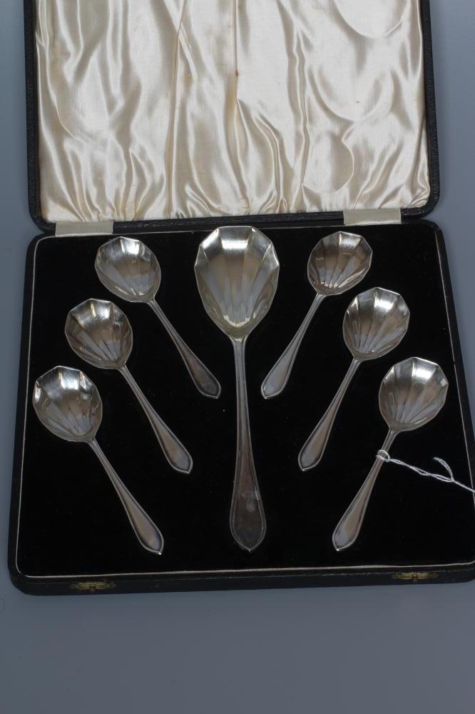 A SET OF SIX GEORGE V SILVER ART DECO FRUIT SPOONS WITH MATCHING SERVER by Viners, Sheffield 1933, Image