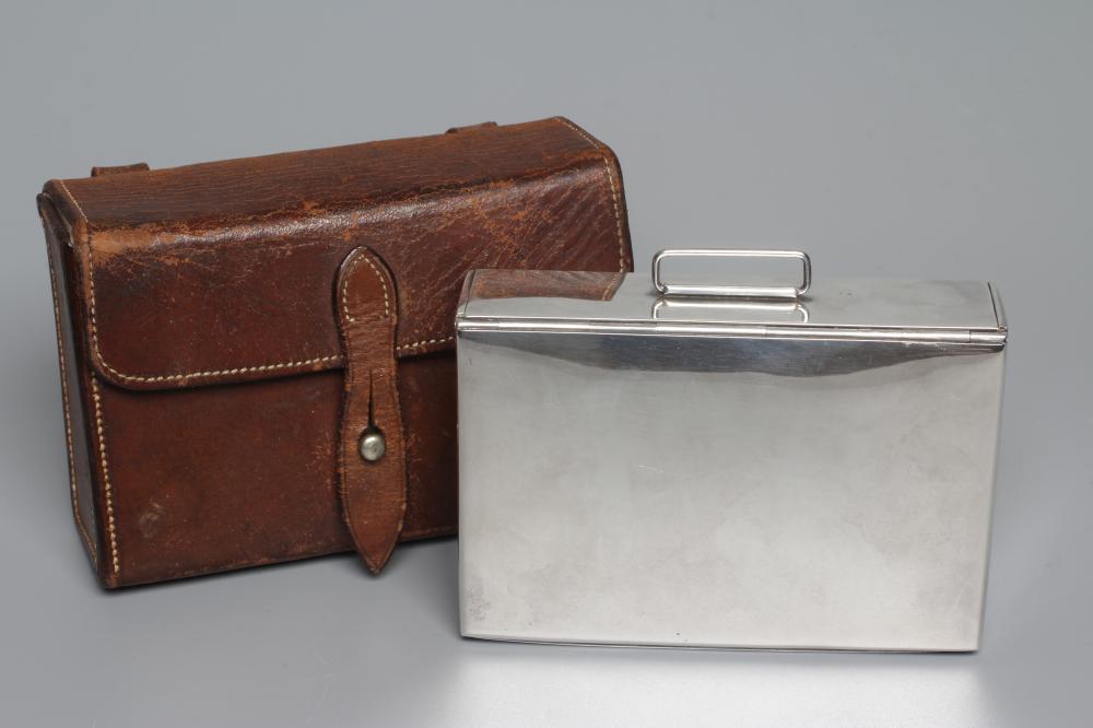 AN EPNS SANDWICH BOX retailed by Swaine & Adenley, of plain oblong form with belt loop, in original Image
