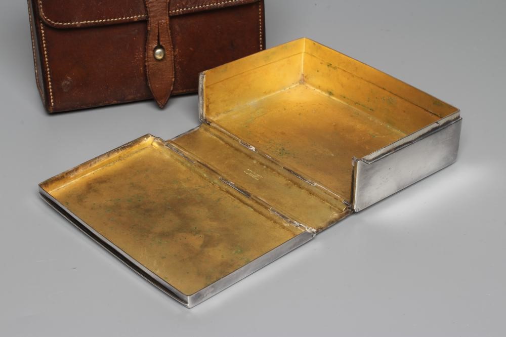 AN EPNS SANDWICH BOX retailed by Swaine & Adenley, of plain oblong form with belt loop, in original Image
