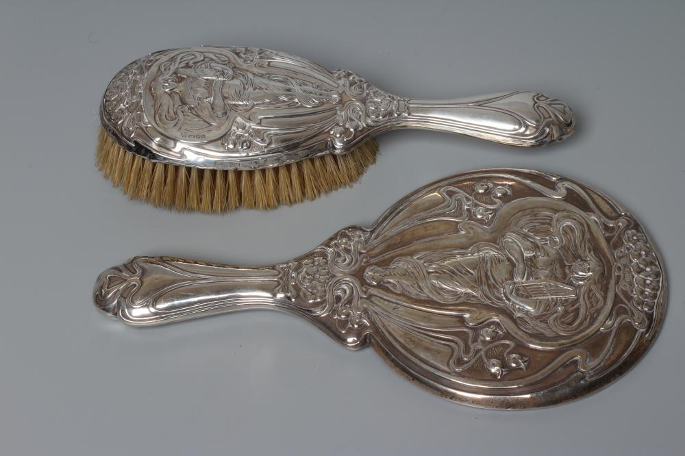 AN EDWARDIAN SILVER ART NOUVEAU HAND MIRROR AND MATCHING HAIRBRUSH by J & W Deakin, Chester 1903, Image