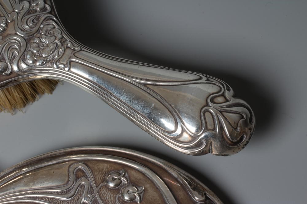 AN EDWARDIAN SILVER ART NOUVEAU HAND MIRROR AND MATCHING HAIRBRUSH by J & W Deakin, Chester 1903, Image