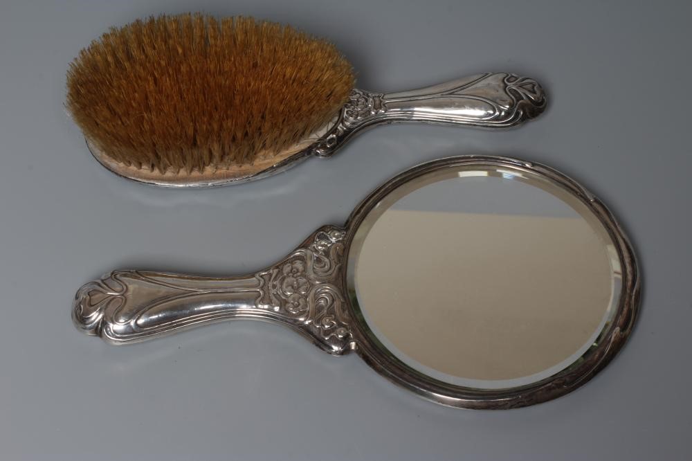 AN EDWARDIAN SILVER ART NOUVEAU HAND MIRROR AND MATCHING HAIRBRUSH by J & W Deakin, Chester 1903, Image