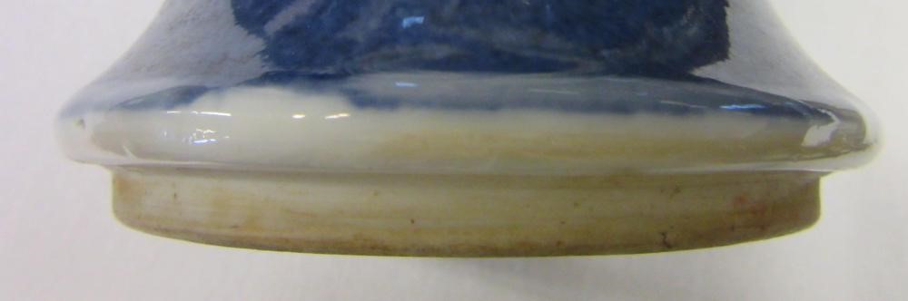 A CHINESE PORCELAIN FAMILLE VERTE VASE of inverted baluster form painted with lobed panels of Image