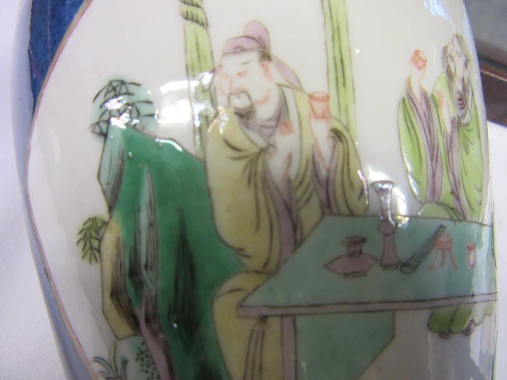 A CHINESE PORCELAIN FAMILLE VERTE VASE of inverted baluster form painted with lobed panels of Image
