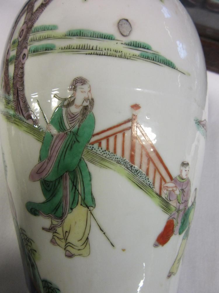 A CHINESE PORCELAIN FAMILLE VERTE VASE of inverted baluster form painted with lobed panels of Image