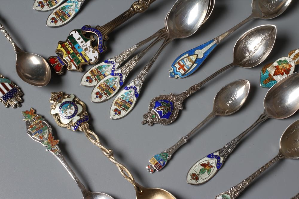 A COLLECTION OF CANADIAN SILVER AND ENAMEL SOUVENIR SPOONS including a set of six teaspoons and a Image