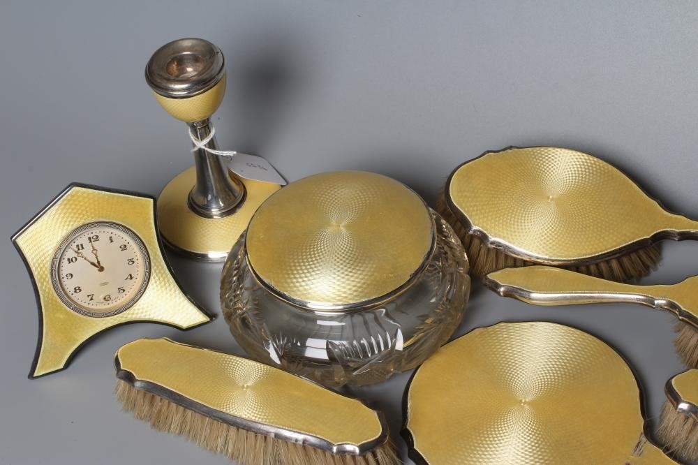 A MATCHED ART DECO SILVER TEN PIECE DRESSING TABLE SET Image