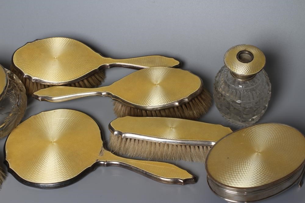 A MATCHED ART DECO SILVER TEN PIECE DRESSING TABLE SET Image