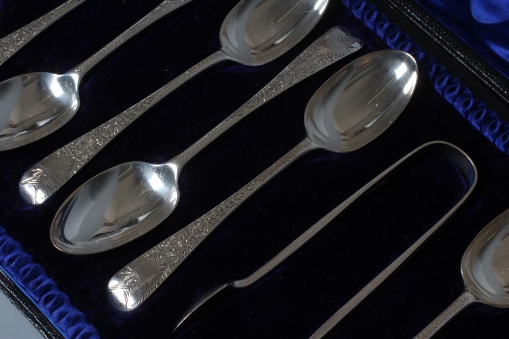 A SET OF TWELVE EDWARDIAN SILVER OLD ENGLISH PATTERN TEASPOONS WITH MATCHING SUGAR TONGS by Josiah Image