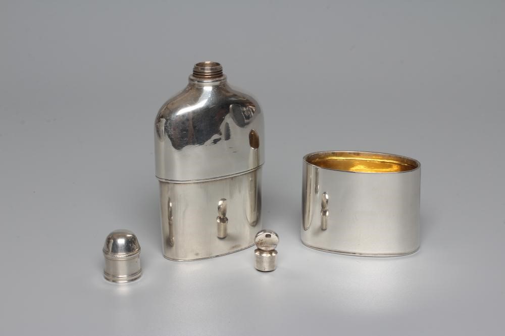 A GEORGE IV SILVER HIP FLASK by John Reily, London 1824, of plain oval section with cup base and Image