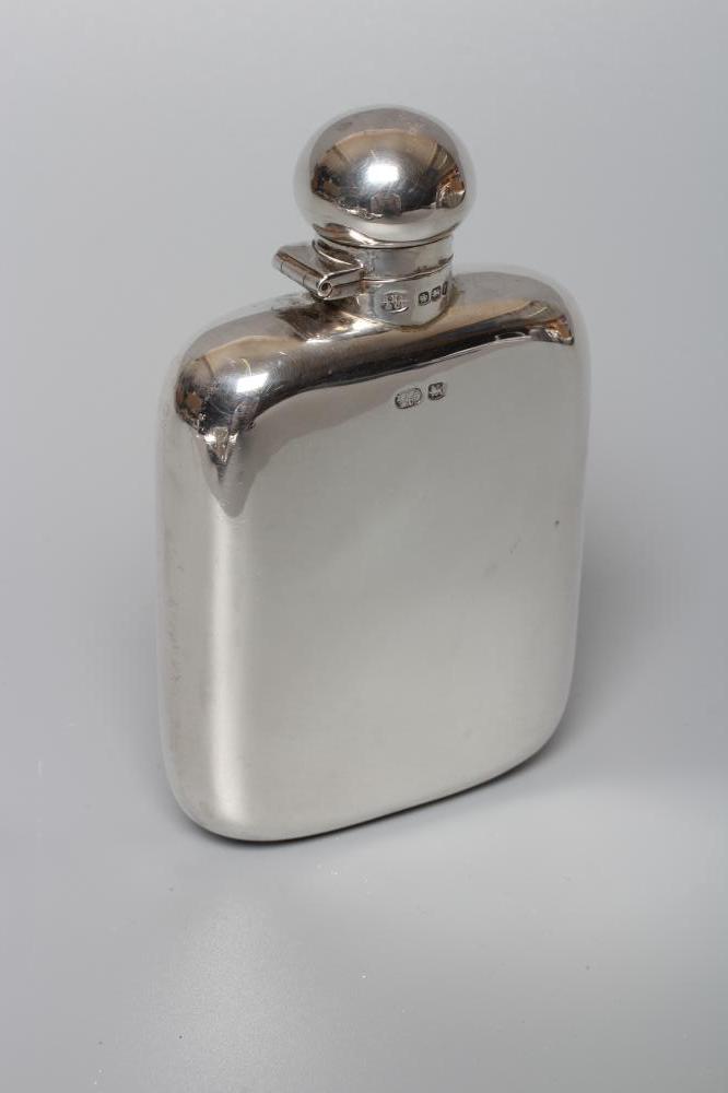 A GEORGE V SILVER HIP FLASK, maker's mark HNH & Co., Sheffield 1923, of plain rounded oblong form Image