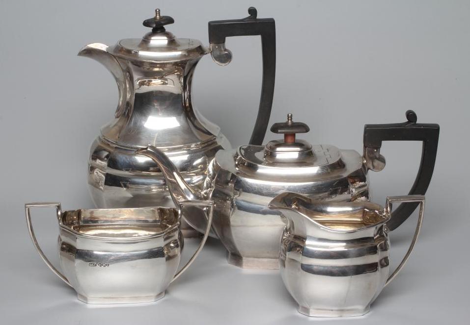 A GEORGE V SILVER COMPOSITE FOUR PIECE TEA AND COFFEE SERVICE by C W Fletcher & Son Ltd. Image