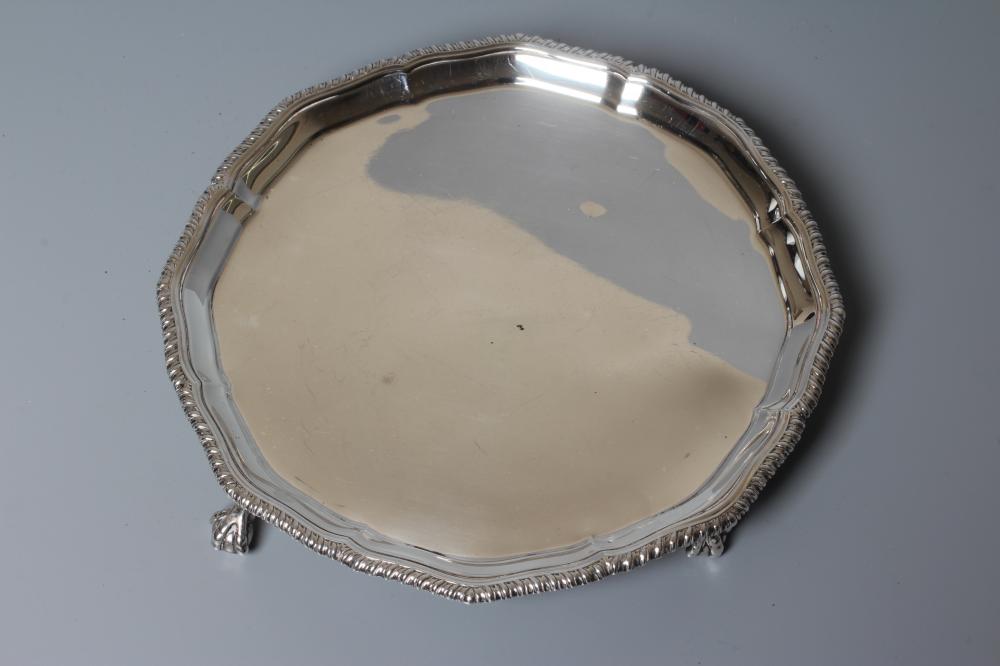 A GEORGE V WAITER by Richard Burbridge for Harrods, London 1935, of shaped circular form with Image